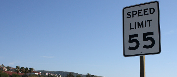 speed limit 55 sign against blue sky