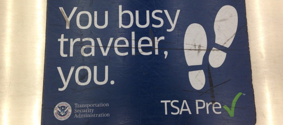 TSA PreCheck sign telling passengers they may leave their shoes on