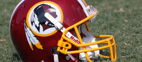 Washington Redskins helmet sitting on grass