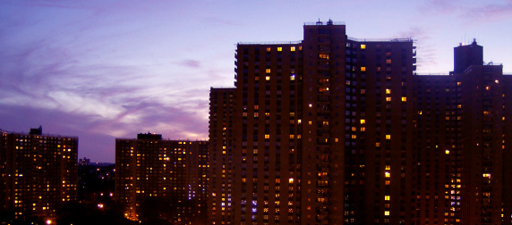 Co-op City highrise in the evening against a sunset