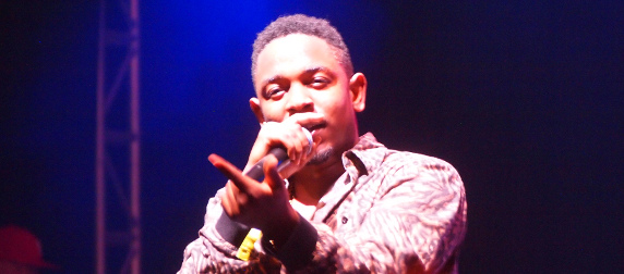 Kendrick Lamar onstage with a microphone