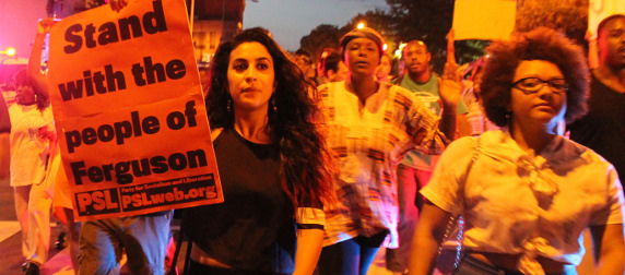 protesters marching with pro Ferguson signs in Washington, D.C.