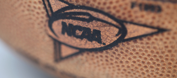 detail of NCAA logo on a football