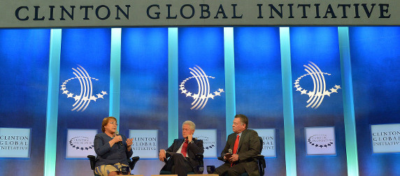 Michelle Bachelet, Bill Clinton and Abdullah II ibn Al Husseib speaking on stage at the Clinton Global Initiative