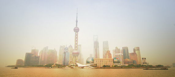 The Pudong, Shanghai, skyline viewed at a distance through smog