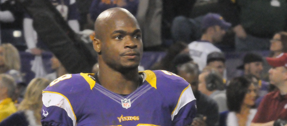 Adrian Peterson on the field, without a helmet