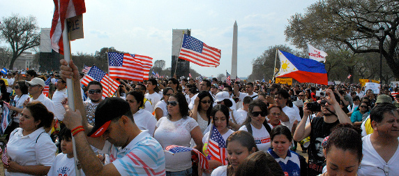 immigration reform demonstrators with flags on the National Mall