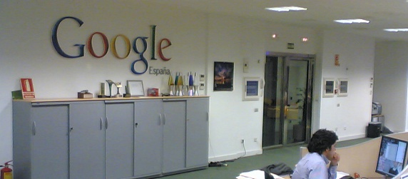 Google Spain office sign, with a worker, three-quarter view