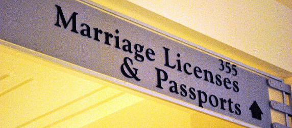 Sign reading 355 Marriage Licenses & Passports