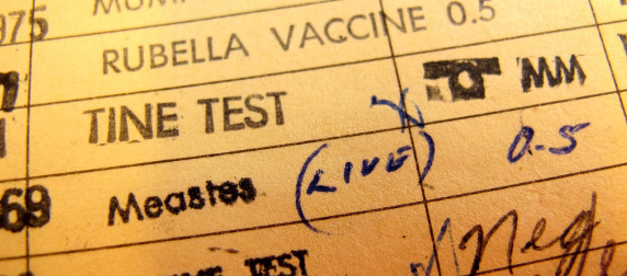 vaccination record, including rubella, a tine test, and measles