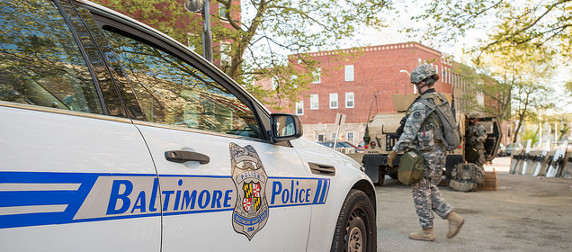 detail of a Baltimore police car and a National Guard soldier