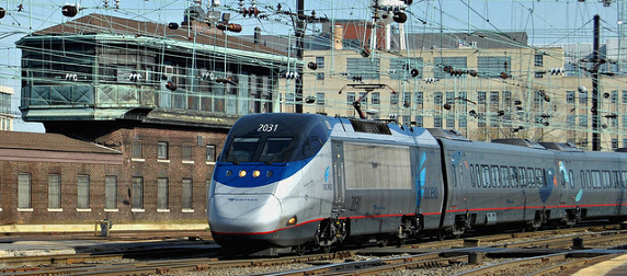 Amtrak Acela train arriving in Washington's union station under various power lines