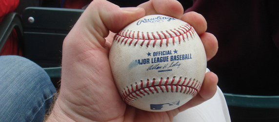 Major League Baseball in the hand of a fan who caught it, Wrigley Field