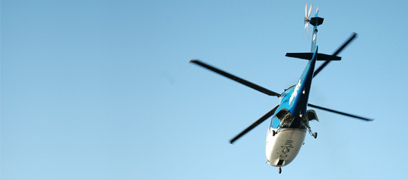 helicopter in flight against a blue sky