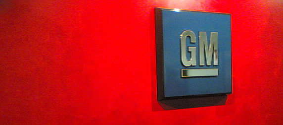 General Motors' logo displayed against a red background