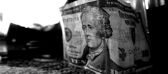 black and white image of a $10 bill, stood on its side