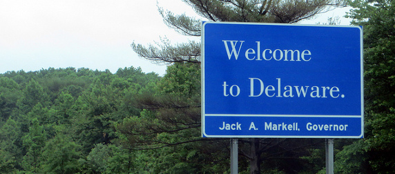 Welcome to Delaware interstate sign against forested background