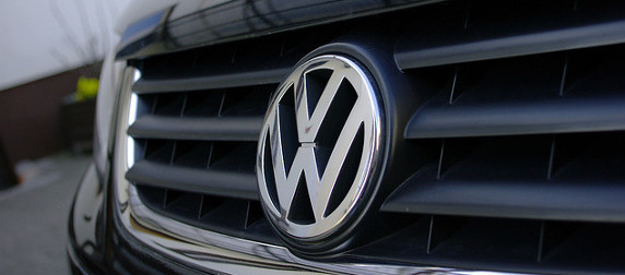 detail of a Volkswagen logo on a car's front grille