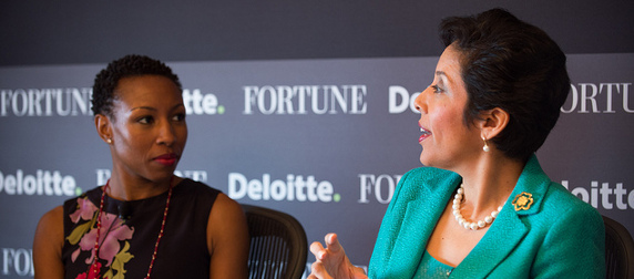 Anna Maria Chavez and Tiffany Dufu speaking in front of a black background reading Fortune and Deloitte