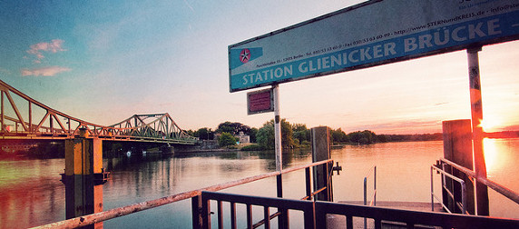 sign reading Station Glienicker Brucke in foreground, bridge in background