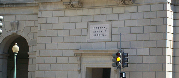 The Internal Revenue Service Building, with a stoplight on yellow