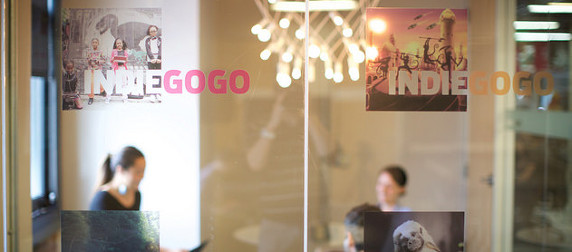 glass doors of IndieGoGo headquarters with people out of focus in the background