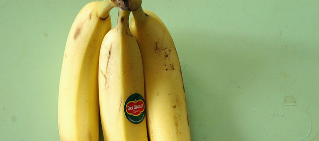 detail of Del Monte bananas against a green background