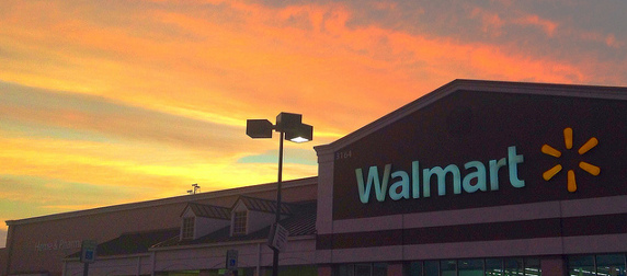 Wal-Mart storefront seen against a sunset sky