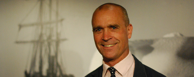 Henry Worsley in front of a backdrop of the ship Endurance