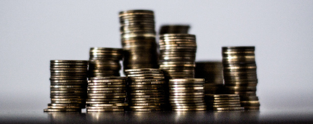 stacks of coins against a neutral background