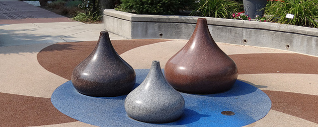 sculptures shaped liked Hershey's Kisses in light brown, dark brown and silver