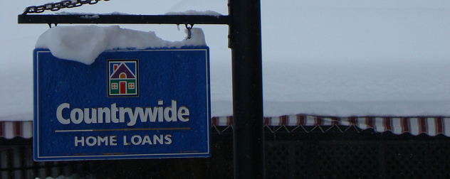 weathered outdoor sign for Countrywide Home Loans, with snow