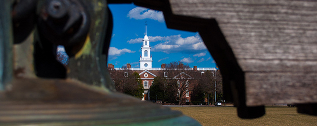 Delaware's Legislative Hall viewed through a gap in a reproduction of the Liberty Bell