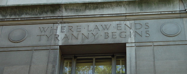 relief on the Robert F. Kennedy Department of Justice Building that reads Where Law Ends Tyranny Begins