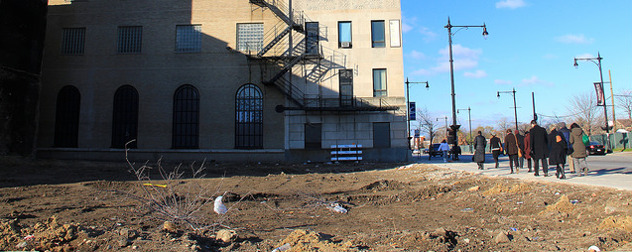 empty dirt lot next to a building in Englewood, Chicago