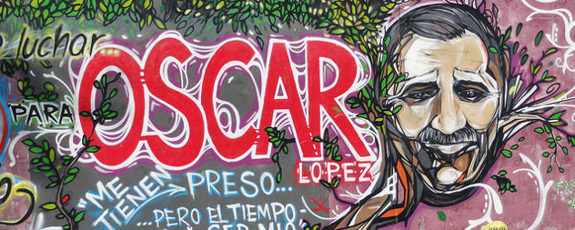 graffiti depicting Oscar Lopez Rivera, with the text 'luchar para Oscar Lopez' and 'Me tienen preso ... pero el tiempo'