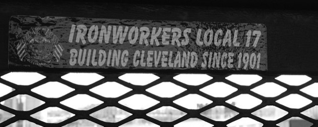 black and white image of a decal on a bridge that reads 'Ironworkers Local 17, Building Cleveland Since 1901'