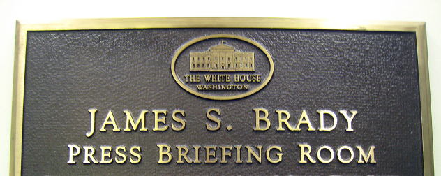 plaque identifying the James S. Brady Press Briefing Room with a White House logo