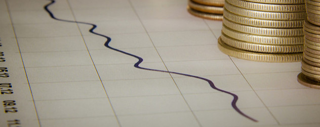 a line graph with stacks of coins on the edge