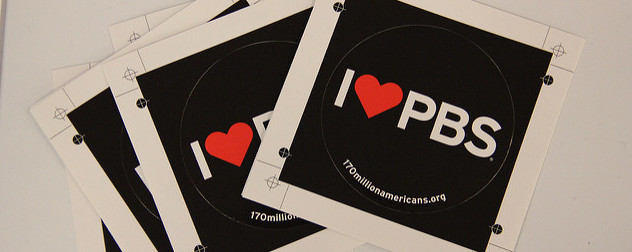 black sticker with white text reading I (heart) PBS