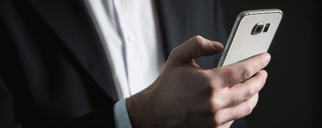 close-up of hand with smartphone