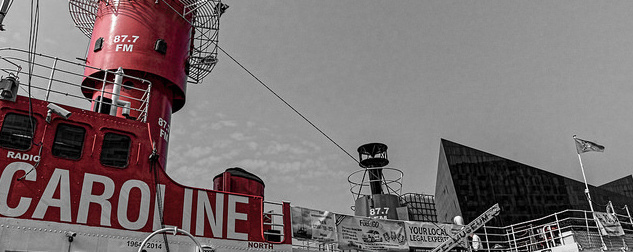 Radio Caroline logo on the Mersey Bar Lightship in Liverpool; black and white image with red accents