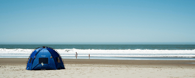 small tent with sides on a beach