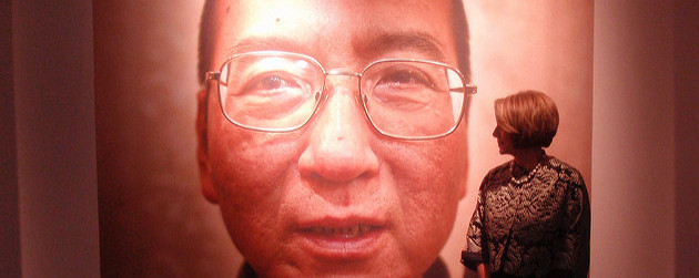 detail of a portrait of Liu Xiaobo, Nancy Pelosi looking on