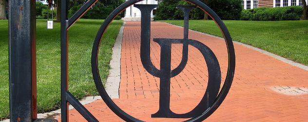 UD logo on a wrought-iron gate
