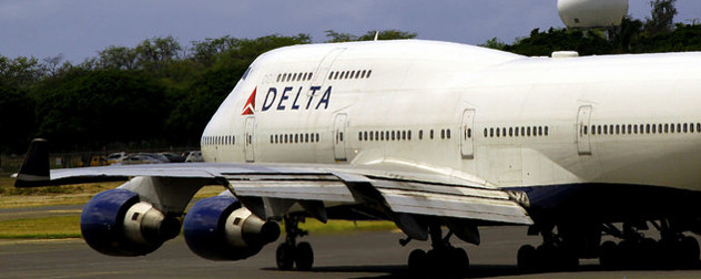 a Delta 747 taxiing on a runway