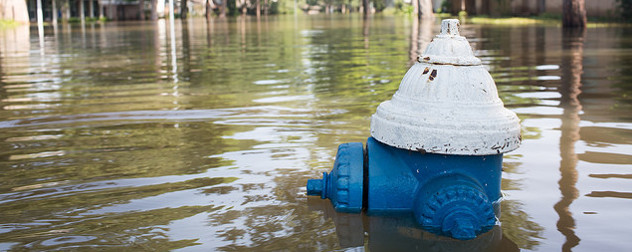 fire hydrant mostly covered with floodwater
