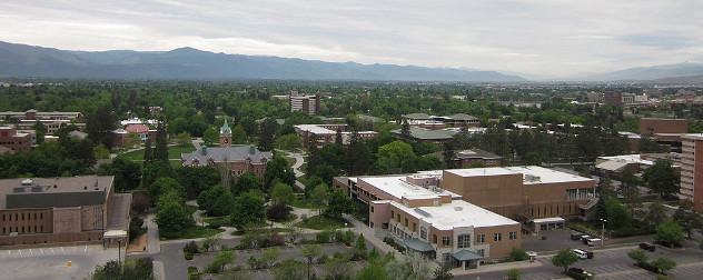 portion of the University of Montana Campus in Missoula as seen from the M-Trail with the Bitteroot Mountains in the back