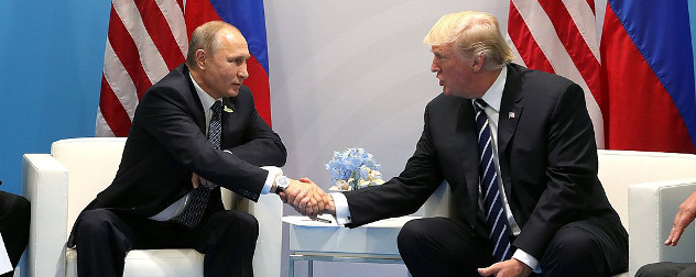 Vladimir Putin and Donald Trump, seated, shaking hands