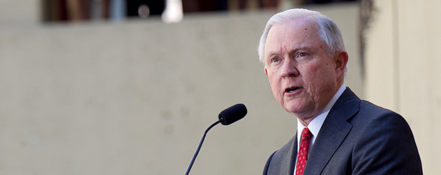 Jeff Sessions speaking at a microphone outdoors